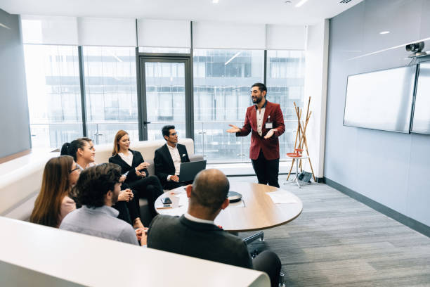 istock Businessman presenting to the team 1306160796