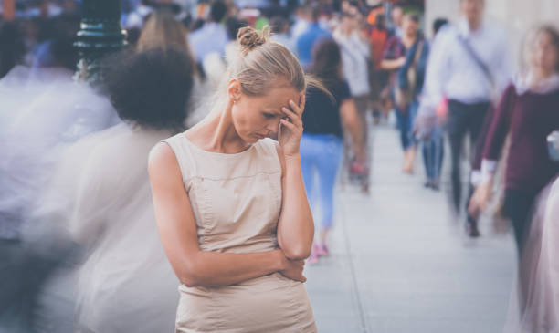 istock Young woman standing still, feeling down, depressed 1306162338