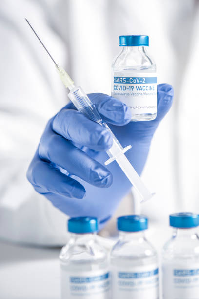 istock Doctor preparing COVID-19 coronavirus vaccine 1306163253