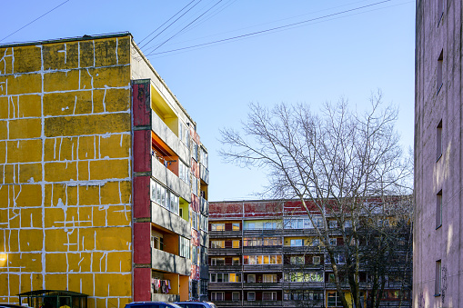dilapidated apartment houses in need of renovation and thermal insulation