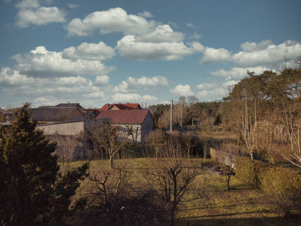 The rural landscape seen from above, farm buildings and houses.