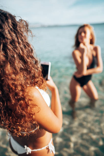 istock take a pic to a friend at the seaside 1306175033