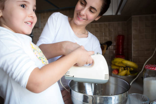 istock Happy family in kitchen 1306179786