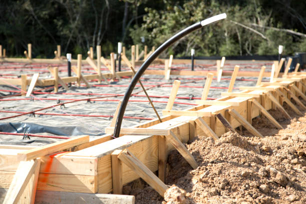 istock Slab preparation at new homes construction site.  Frames going up. 1306180038