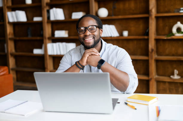 istock An African-American guy using a laptop indoor 1306184112
