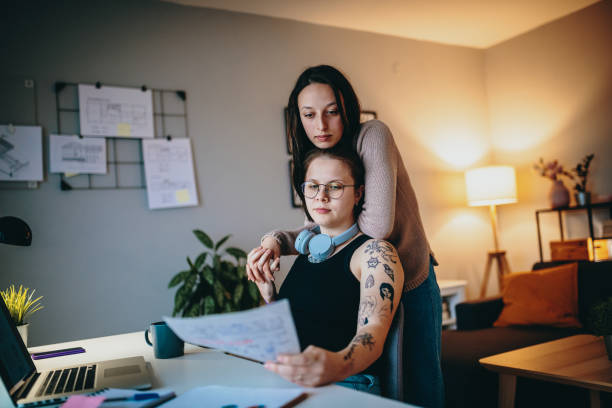 istock Gen-Z lesbian couple working from home and sharing love 1306184185