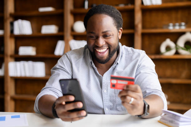 istock An African-American guy using a smartphone for online shopping 1306184374