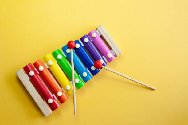 istock Multi colored xylophone music instrument isolated on yellow background 1306185666