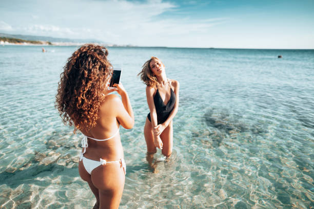 istock take a pic to a friend at the seaside 1306186592