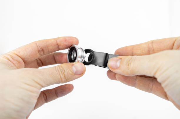 istock Phone photo lens with clips on white background. Extra macro camera for smartphone 1306186805
