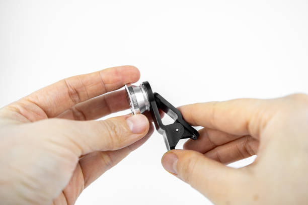 istock Phone photo lens with clips on white background. Extra macro camera for smartphone 1306186836
