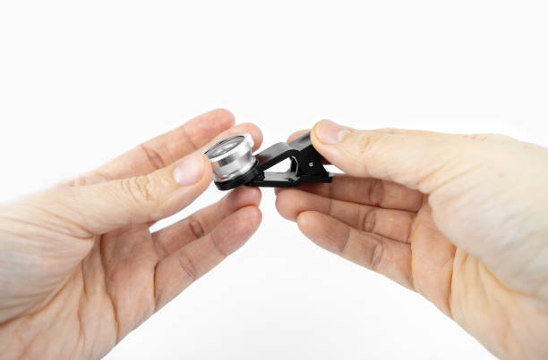 istock Phone photo lens with clips on white background. Extra macro camera for smartphone 1306186837