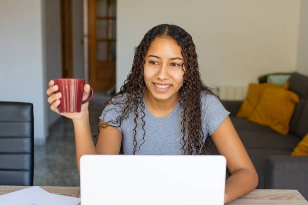 istock young girl smiling with a cup of coffee. 1306190697