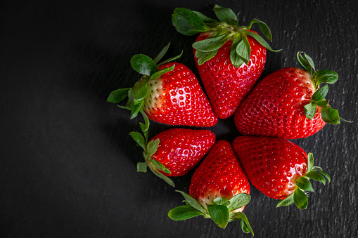 group of strawberries with black background