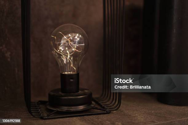 Edison Lighbulb On A Stand One Old Decorative Lamp For Loft Stock Photo - Download Image Now
