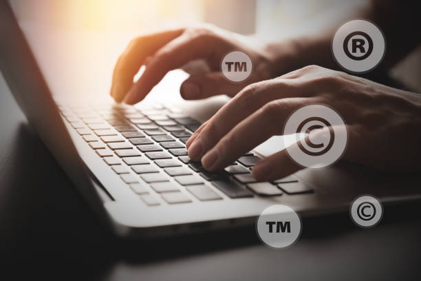Concept of copyrighted material with laptop Concept of copyrighted material. Copyright, registered symbols with laptop composition trademark stock pictures, royalty-free photos & images