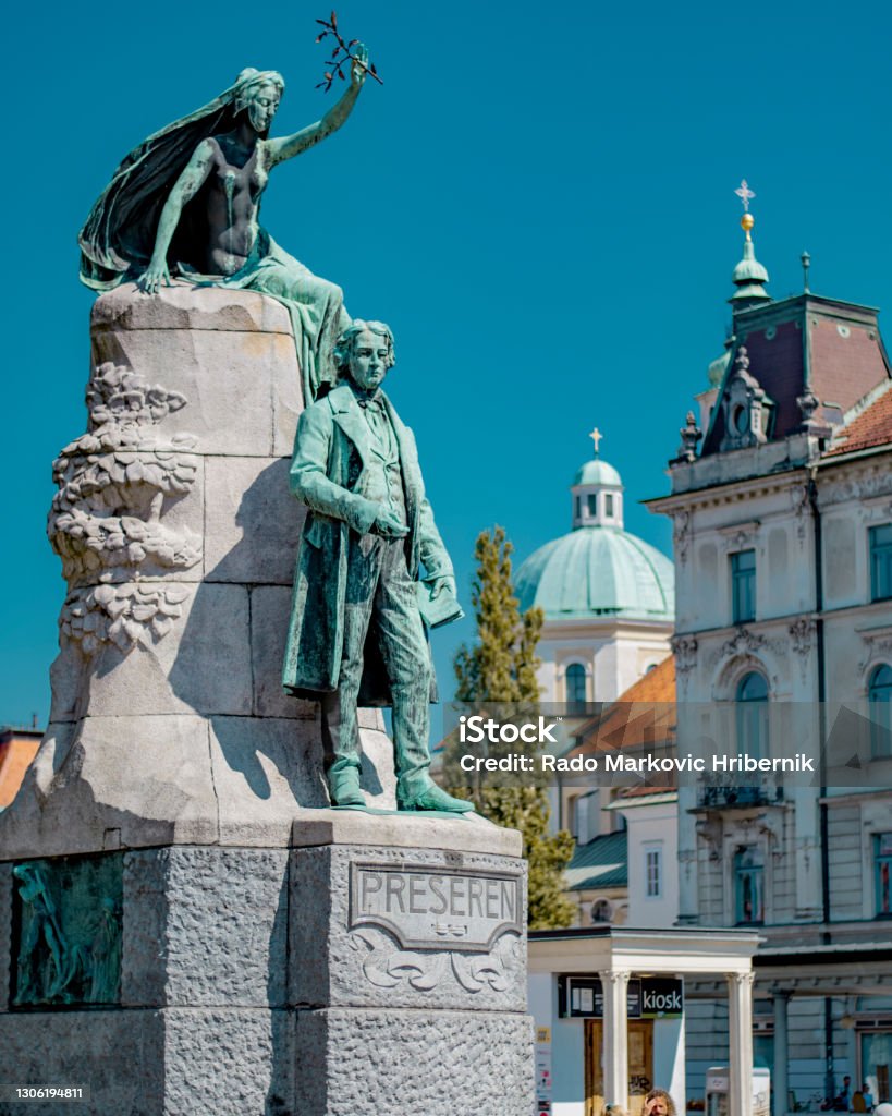 Preseren statue with Ljubljana Cathedral in the background, Central Slovenia Region Sculpture Stock Photo