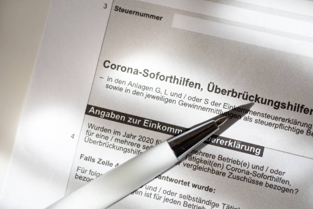 istock Request for emergency aid, close-up of a German application form/allowance for Corona emergency aid - Emergency aid Corona. 1306195764