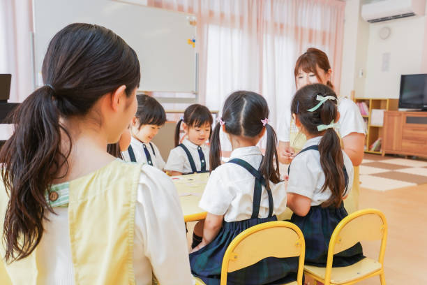 istock Children and teacher at nursery school 1306196040