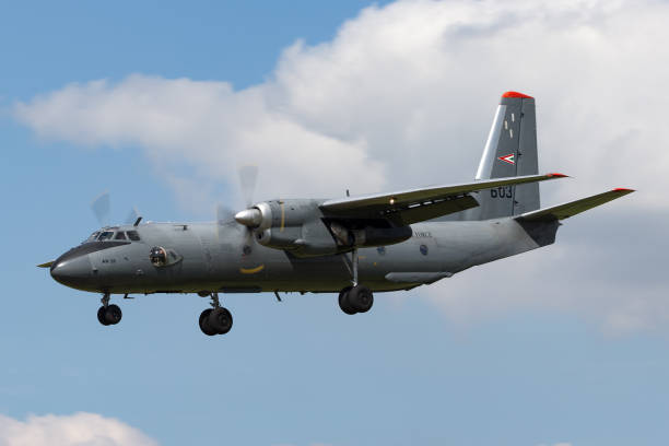 Hungarian Air Force Antonov An-26 on approach to land at RAF Fairford. Gloucestershire, UK - July 11, 2014: Hungarian Air Force Antonov An-26 military transport aircraft on approach to land at RAF Fairford. antonov an 26 stock pictures, royalty-free photos & images