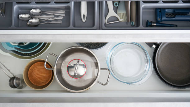istock Set of clean kitchenware and utensils in drawers, above view. 1306196800