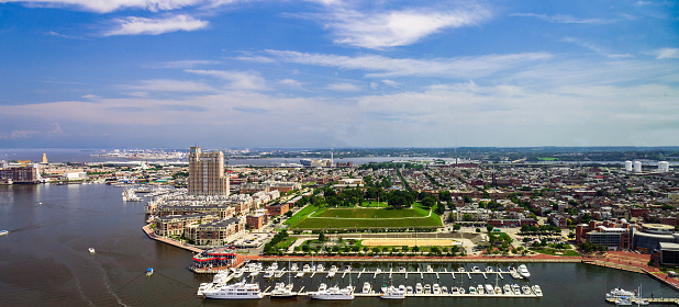 Aerial view of the Baltimore Inner Harbor, the homes and Condominiums overlooking a Marina, and the famous Federal Hill Park in Baltimore, Maryland