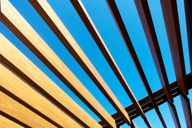 Canopy with wooden roof at sky background Canopy with wooden roof patio cover stock pictures, royalty-free photos & images