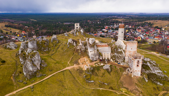 Aerial view of ruined medieval fortified Olsztyn Castle located in Krakow-Czestochowa Upland on Trail of Eagles Nests on spring day, Poland