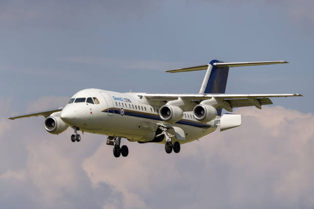 Avro RJ70 aircraft on approach to land at RAF Fairford. Gloucestershire, UK - July 11, 2014: Avro RJ70 aircraft G-BVRJ from the Empire Test Pilots School on approach to land at RAF Fairford. british aerospace stock pictures, royalty-free photos & images