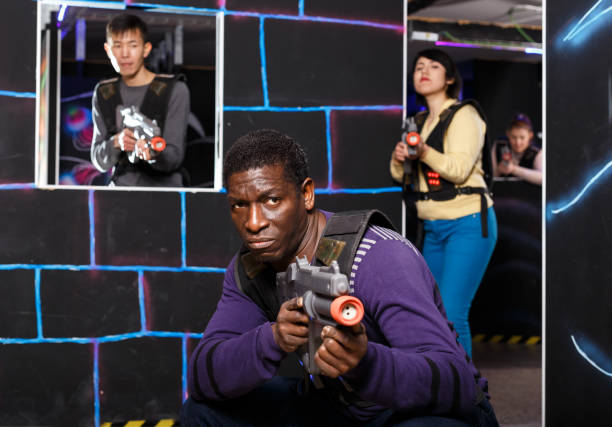 istock African American man playing lasertag 1306202320