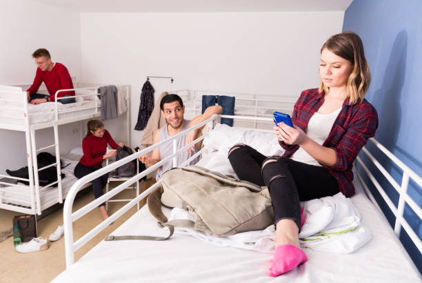 istock Girl ignoring neighbors in hostel 1306202470