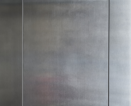 detail of stainless steel panels belonging to an elevator wall
