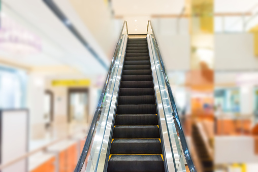 Escalator in business center or shopping mall interior