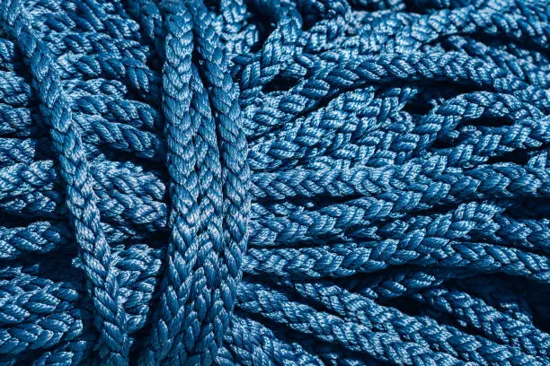 Photo of Close-up of a blue rope. A coil of blue ropes.