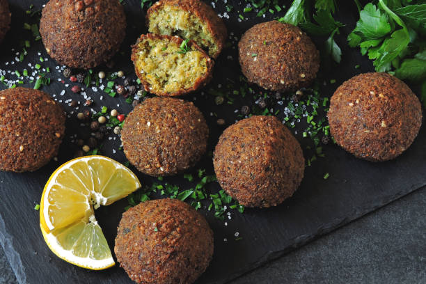 Falafel with spices on a stone board. stock photo