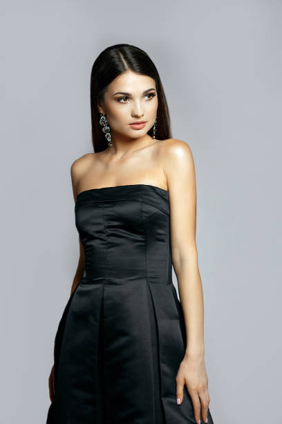 istock Seductive woman wears silk dress 1306211704