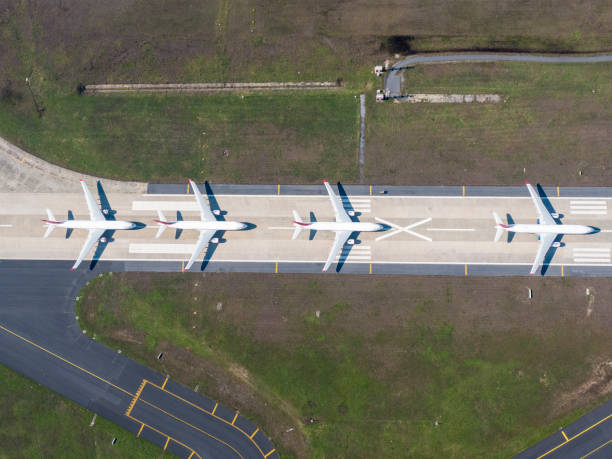 Aerial view of an airport Airport, Airplane, Airport Runway, Commercial Airplane airport runway photos stock pictures, royalty-free photos & images