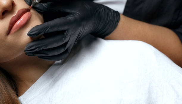 istock Woman with lip tattooing 1306213596