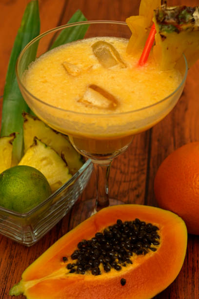 istock tropical cocktail with pineapple lime papaya orange 1306213921
