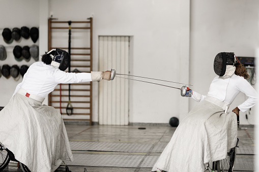 Wheelchair fencing athletes training