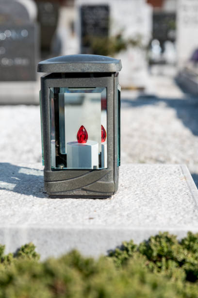 istock Grave Metal Lantern at the Cemetery 1306214825