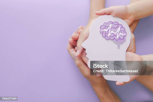Adult And Child Hands Holding Encephalography Brain Paper Cutoutautism Stroke Epilepsy And Alzheimer Awareness Seizure Disorder Stroke Adhd World Mental Health Day Concept Stock Photo - Download Image Now