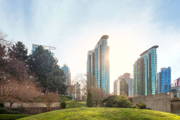 istock Sunlight Shining on Modern Apartments, Office Buildings, Public Park 1306217519