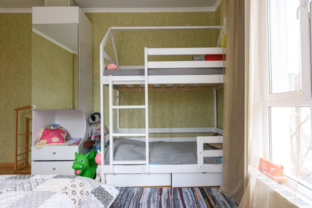 istock Bedroom interior with large children's bunk bed 1306218412