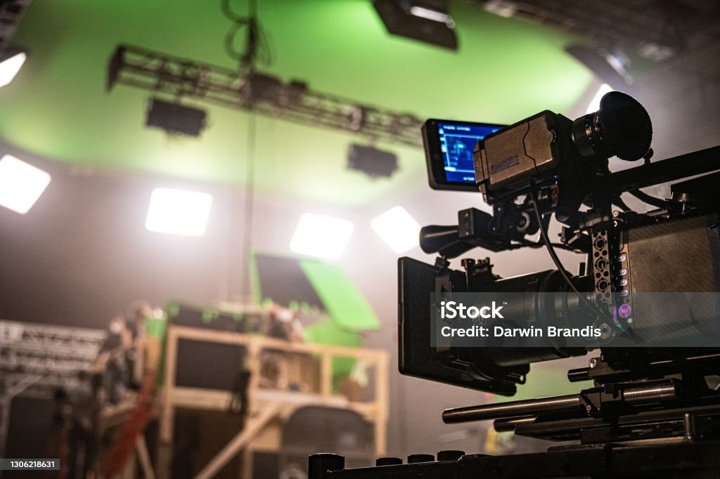 Digital Cinema Camera, On Set A professional digital cinema camera, on a film set. Movie Stock Photo