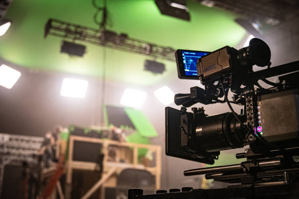 Digital Cinema Camera, On Set A professional digital cinema camera, on a film set. hollywood set stock pictures, royalty-free photos & images
