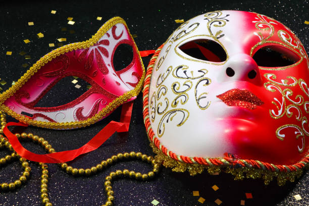 istock Red And White Carnival Masks With Gold Confetti And Beads 1306221586