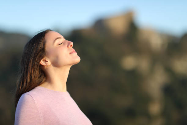 istock Relaxed lady breathing fresh air in the mountain 1306225465
