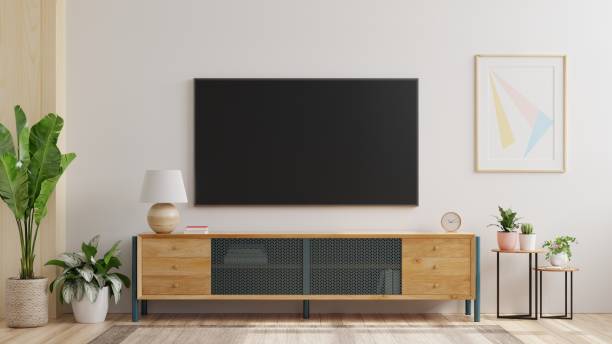 mockup eine tv-wand in einem wohnzimmer mit einer weißen wand montiert. - heimkino anlage stock-fotos und bilder