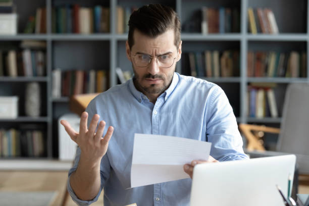 istock Office employee read complaint letter feels stressed 1306230733